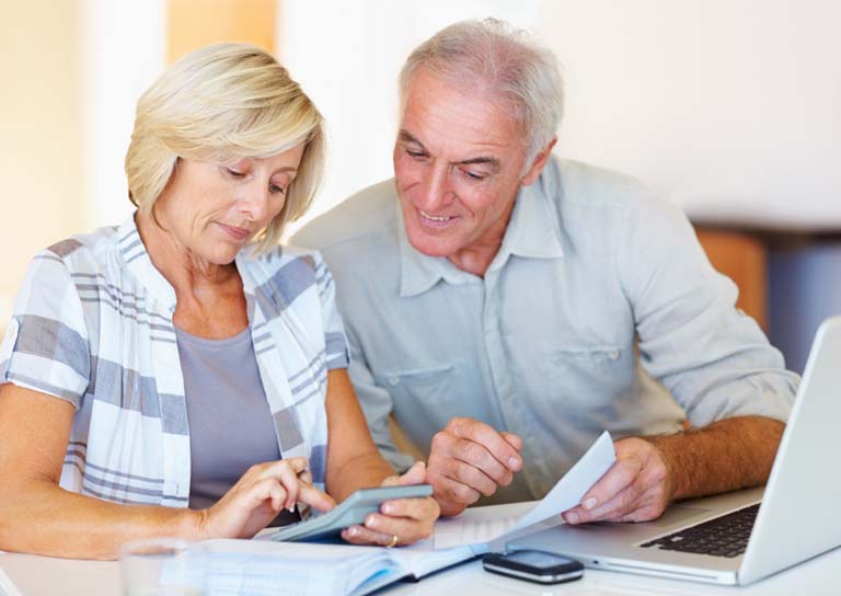 older couple looking at financial paperwork
